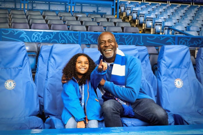 Grandfather and granddaughter enjoying Chelsea FC stadium tour